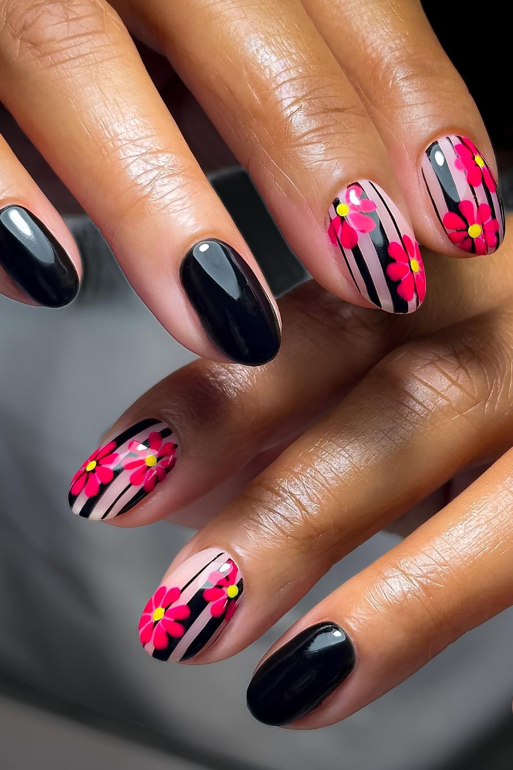 Black and transparent striped nails with pink florals