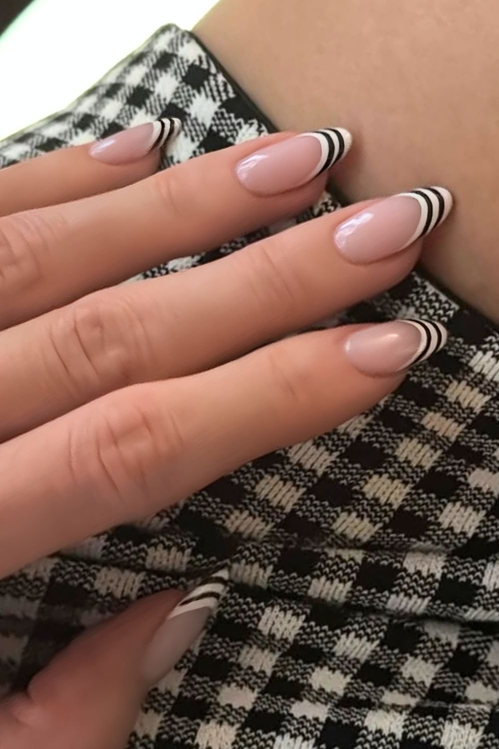 Black and white striped French tip nails