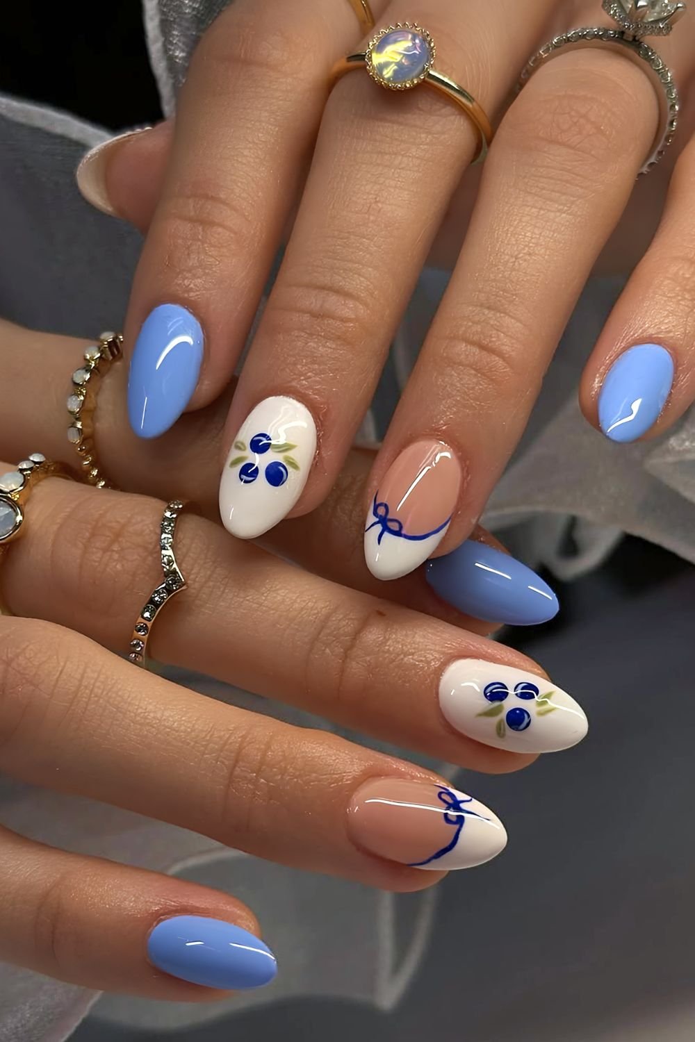 Blue and white nails wit accent French tips. bows and blueberries