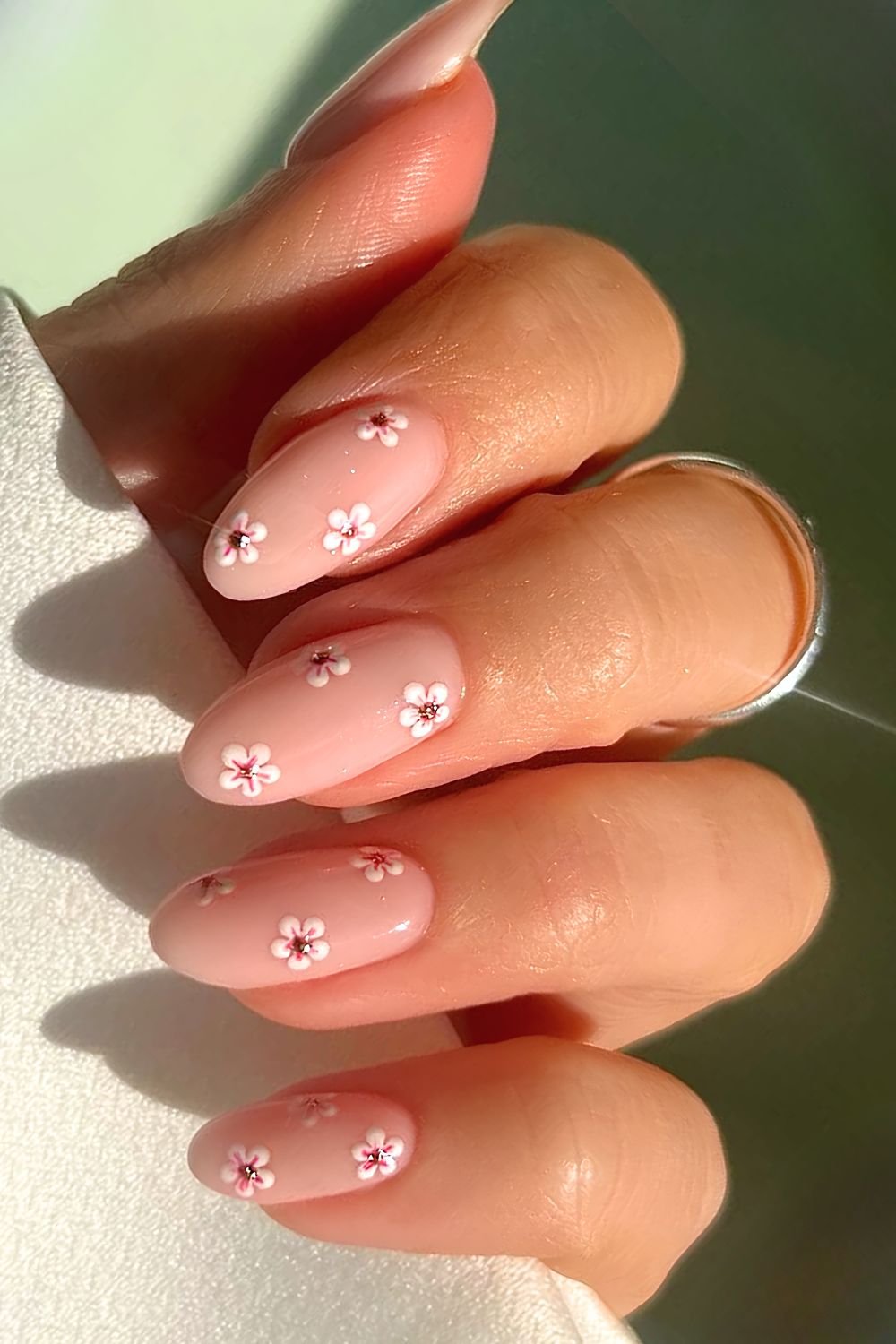 Cherry blossom nails with rose gold studded flower centers
