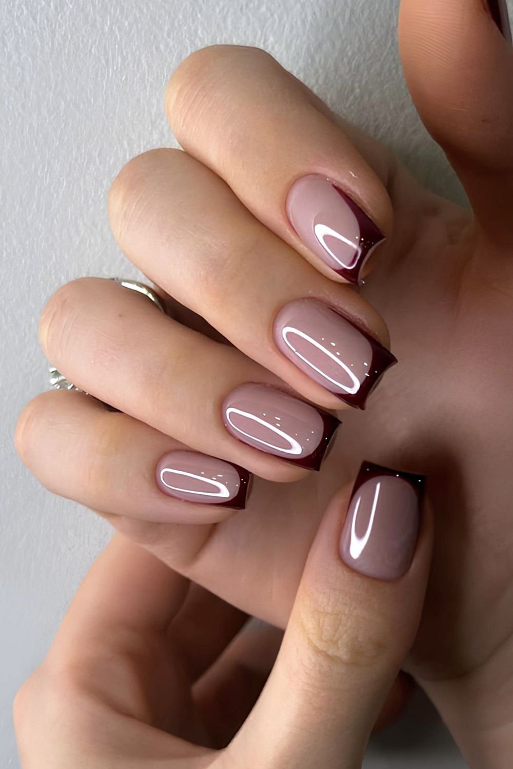 Dark brown French tip nails