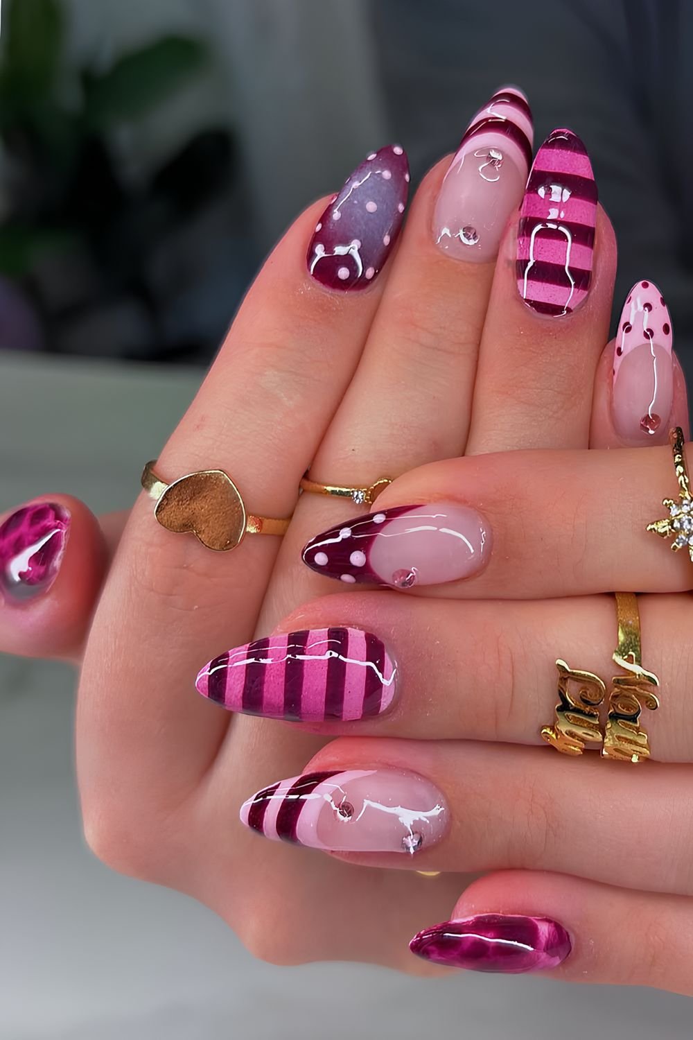 Dark red and pink horizontal and vertical striped nails
