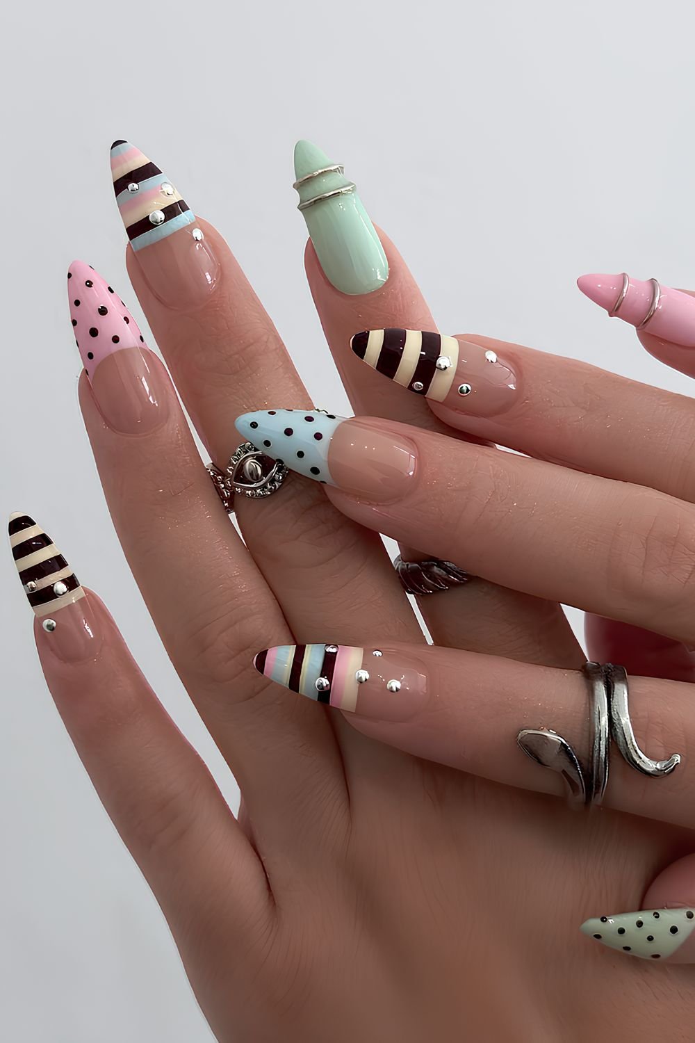 Deep French tip nails in polka dot and stripe pattern