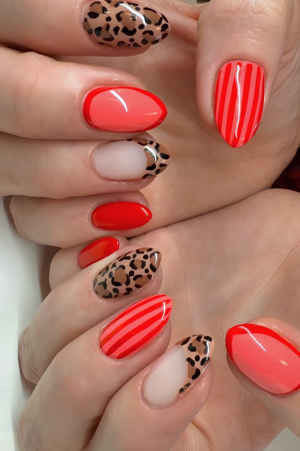 Fiery red stripes and leopard print nails