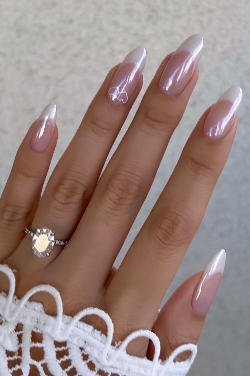 Glazed white French nails with intertwined hearts