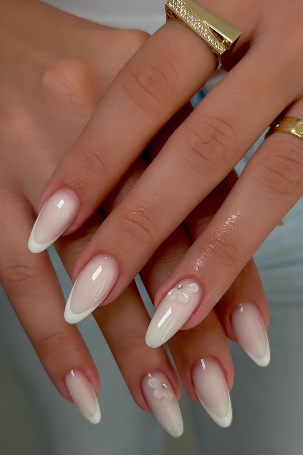 Glossy white on white nails with half floral 3d accents