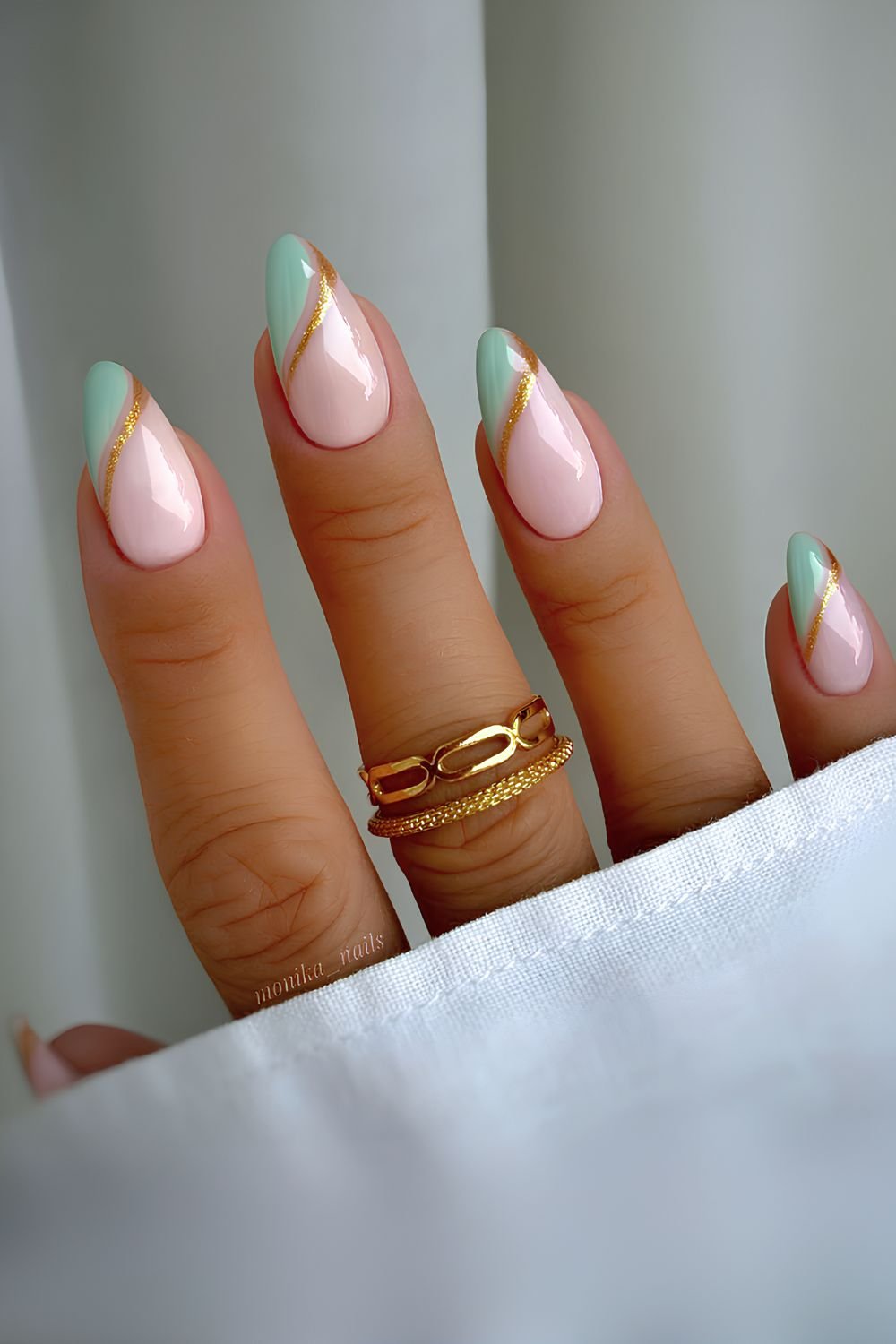 Green side French nails with gold glitter outline