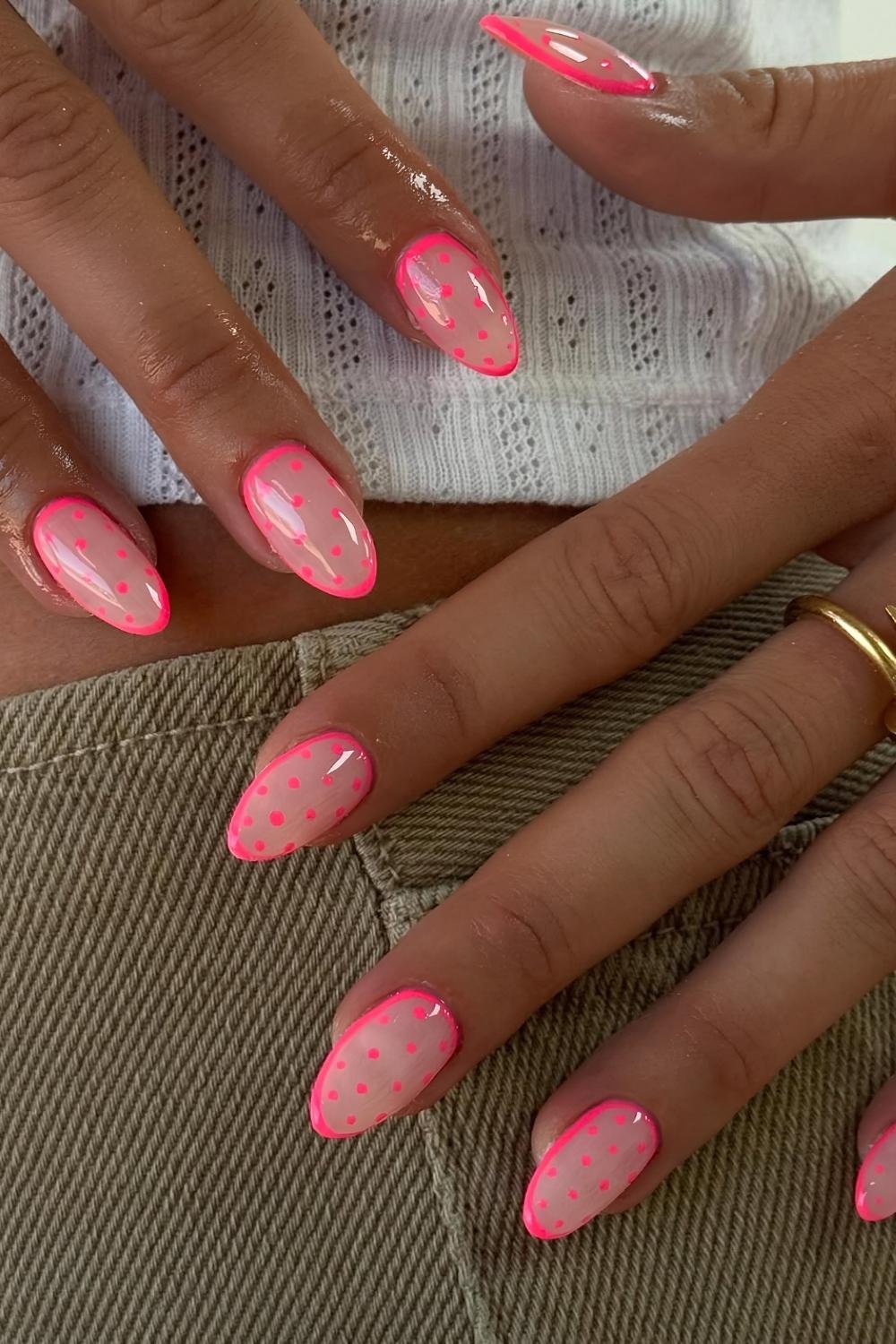 Hot pink polka dot nails on neutral base