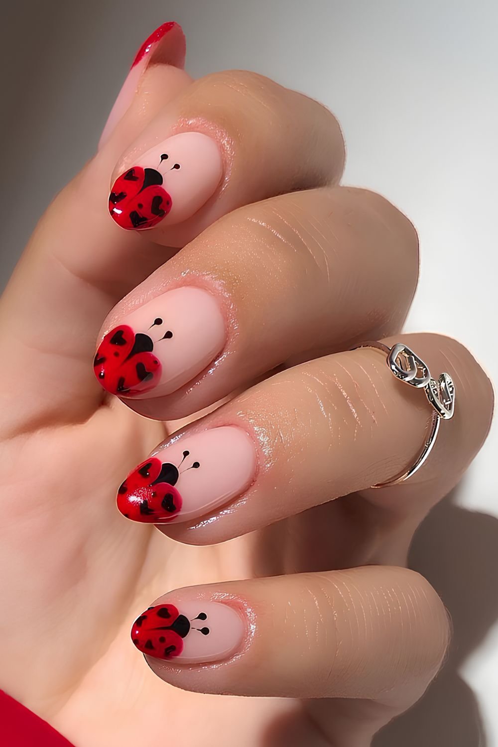 Ladybug French tip manicure