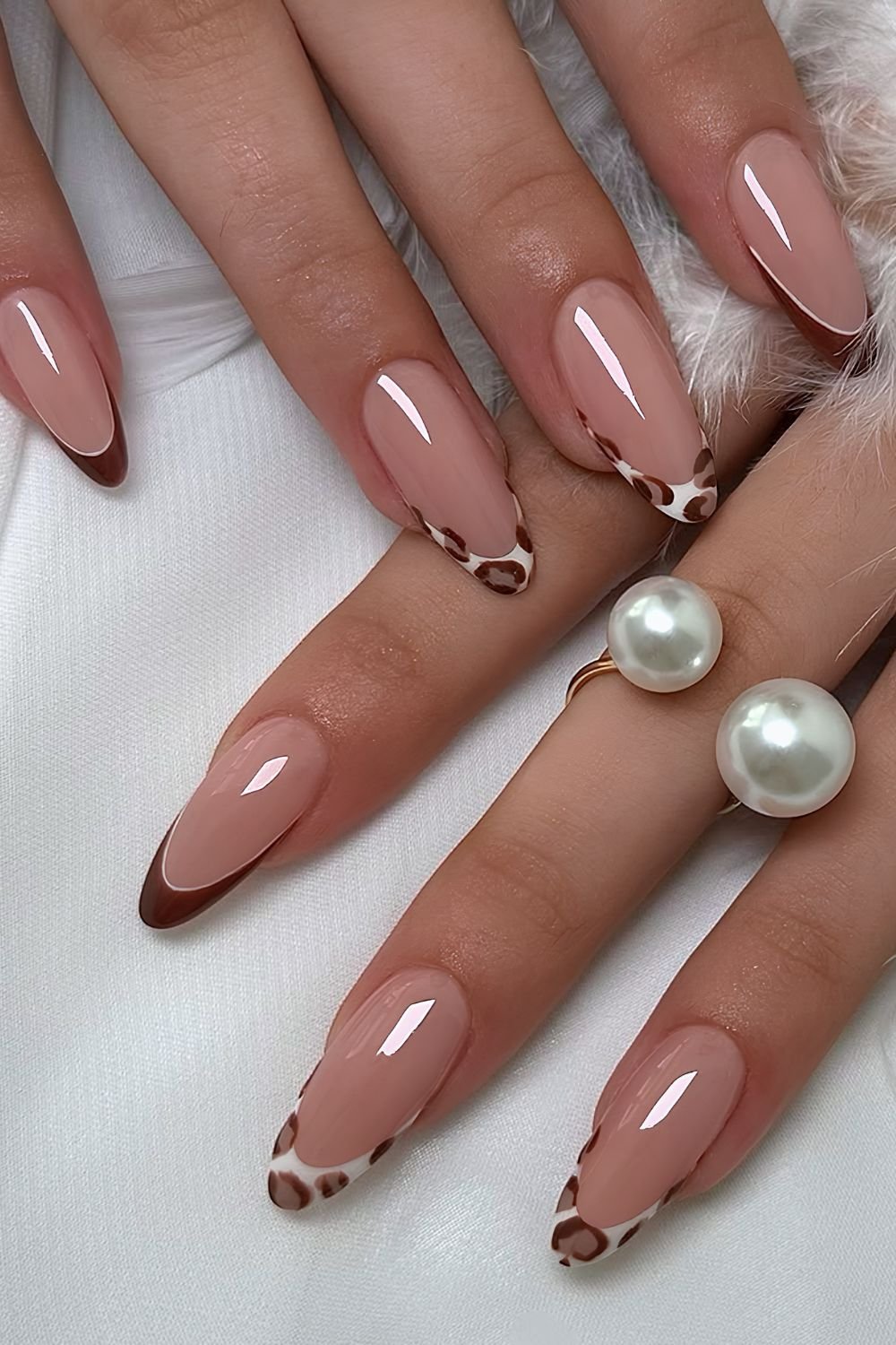 Leopard print and brown French tip nails