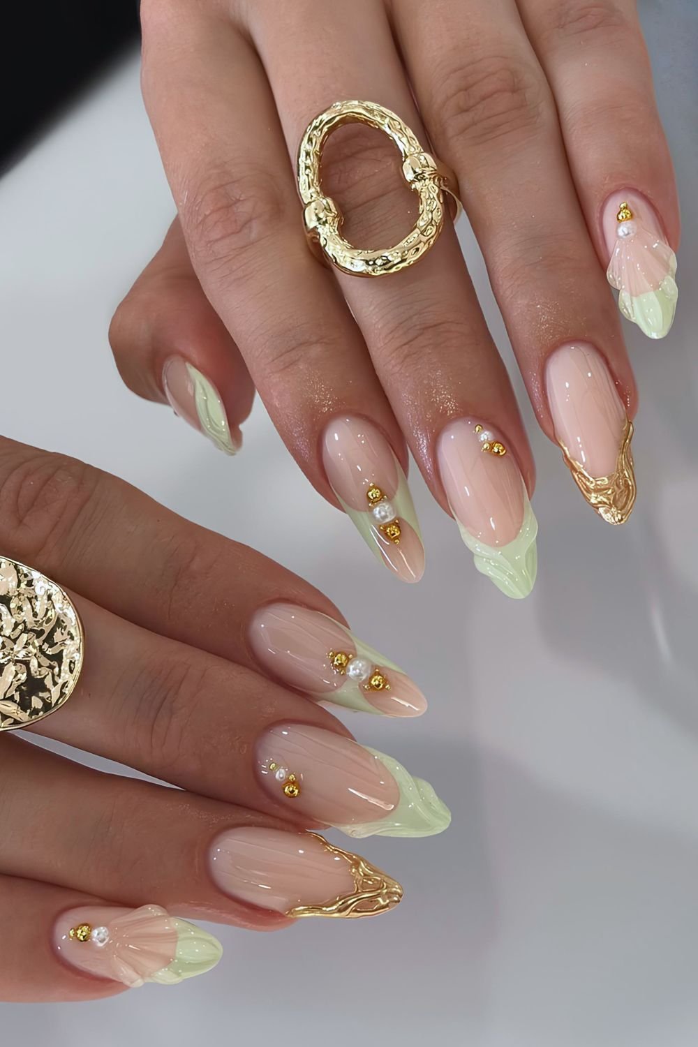 Matcha Green textured and peek a boo French tip nails with gold accents