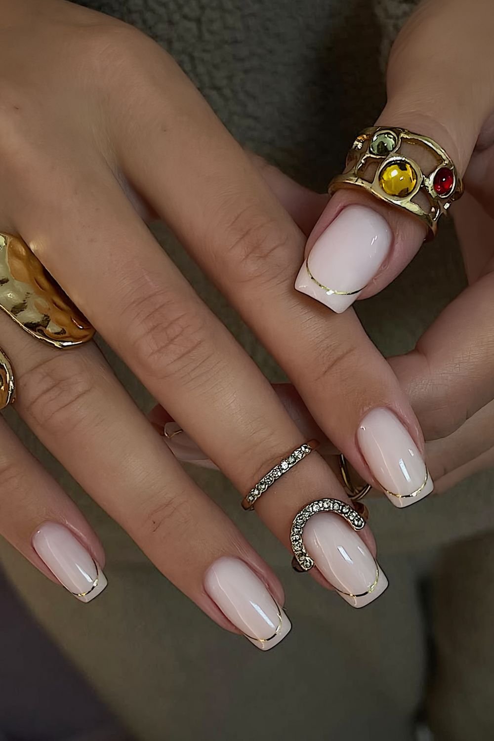 Milky White nails with gold French tip outlines