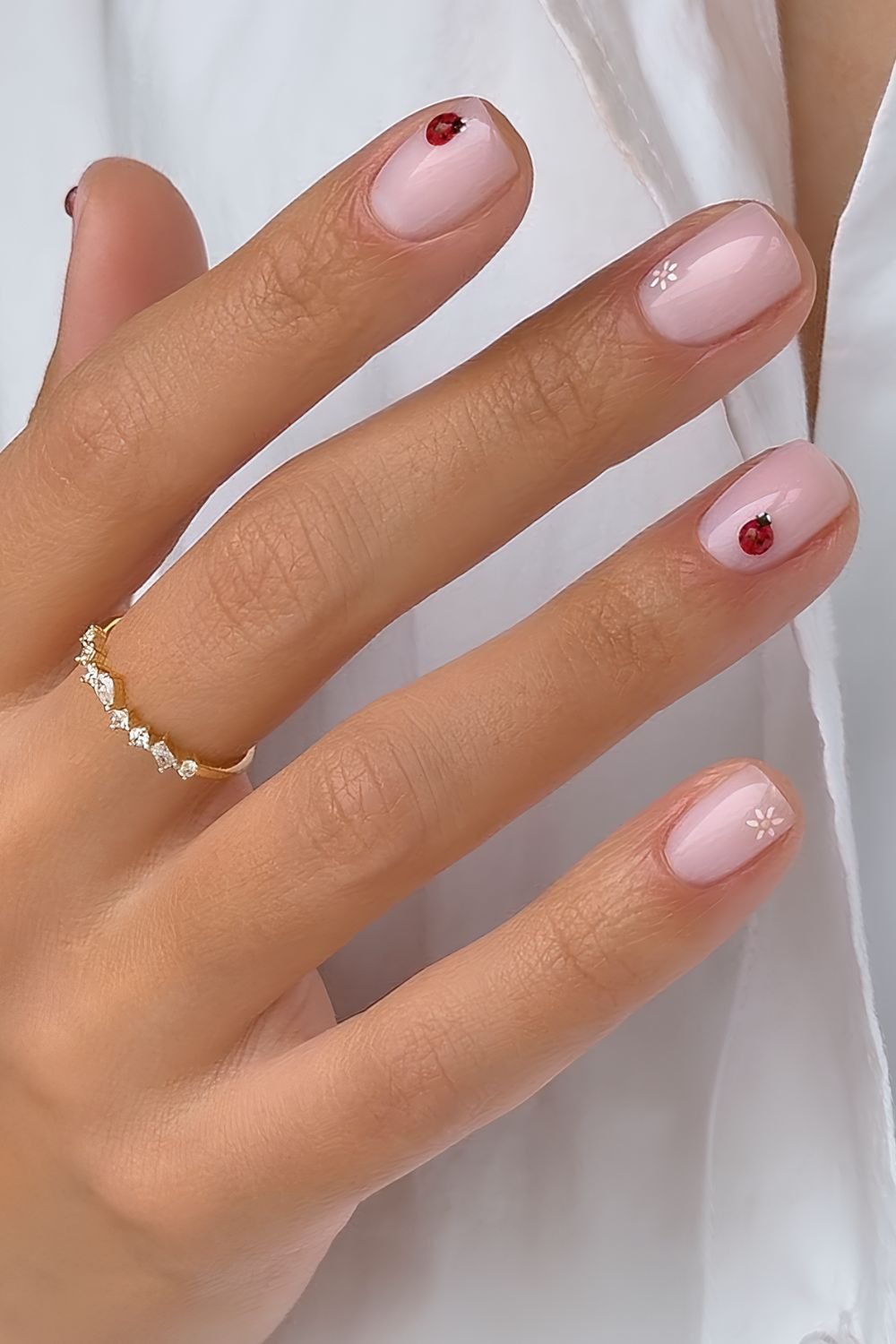 Milky pink nails with micro 3d lady bug and daisy accents