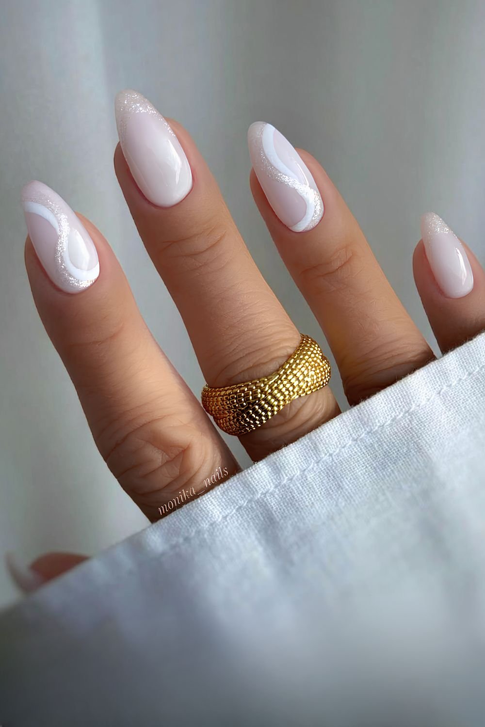 Milky white nails with swirls and white glitter