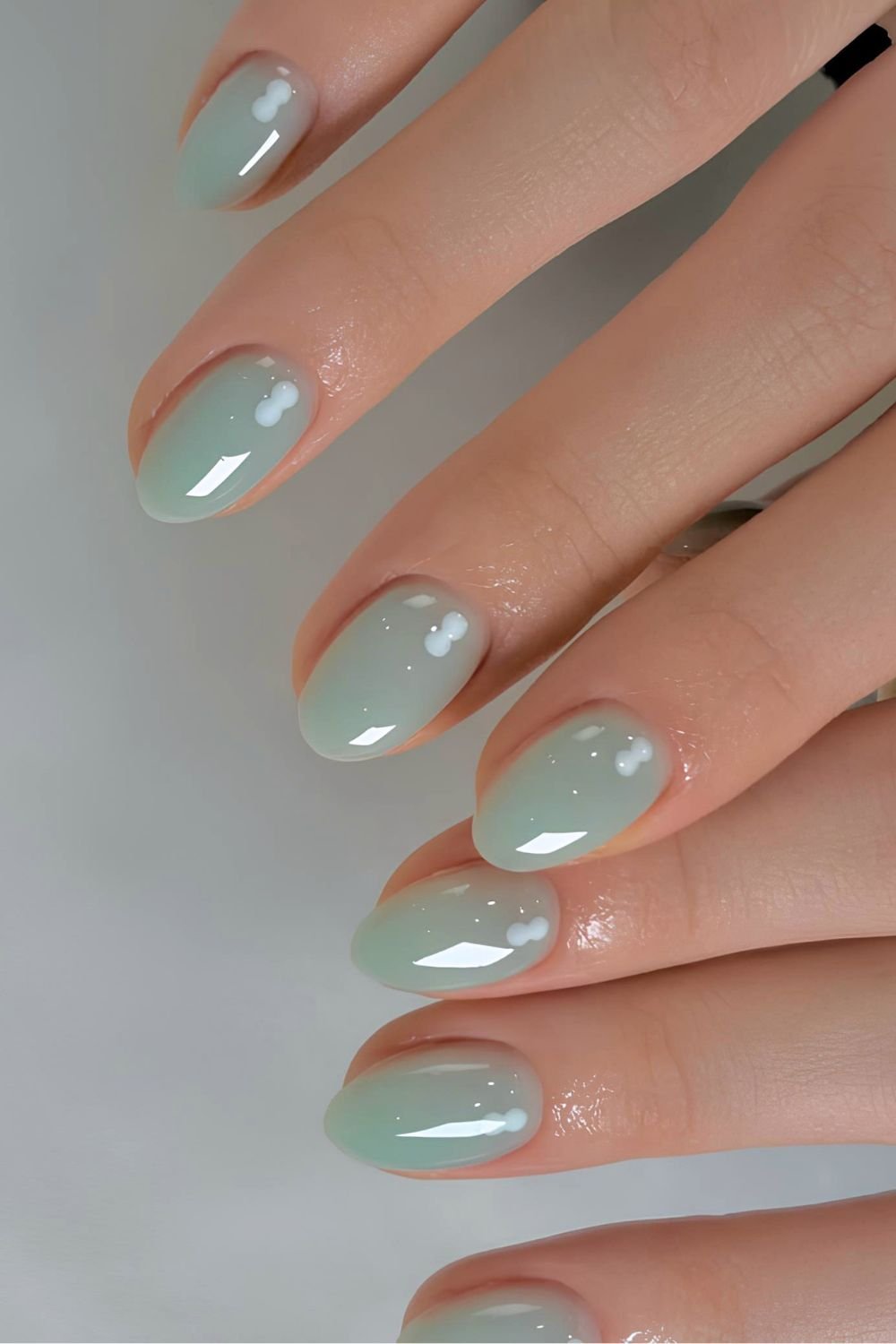 Mint green gel nails with clear chrome