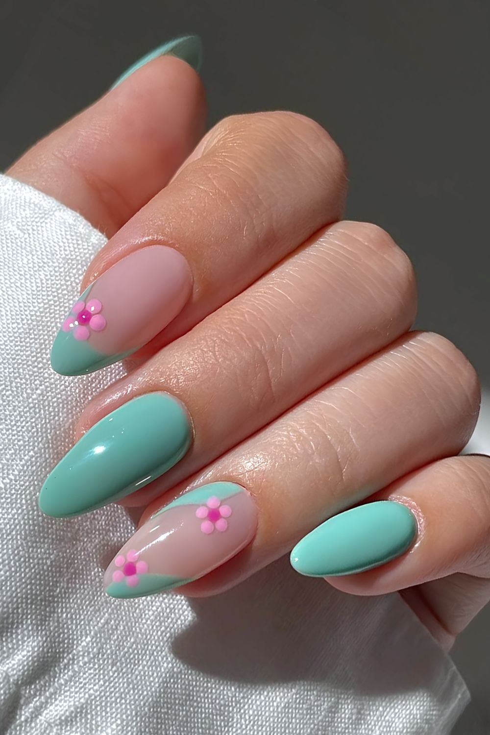 Mint green nails with pink cherry blossom floral nail art