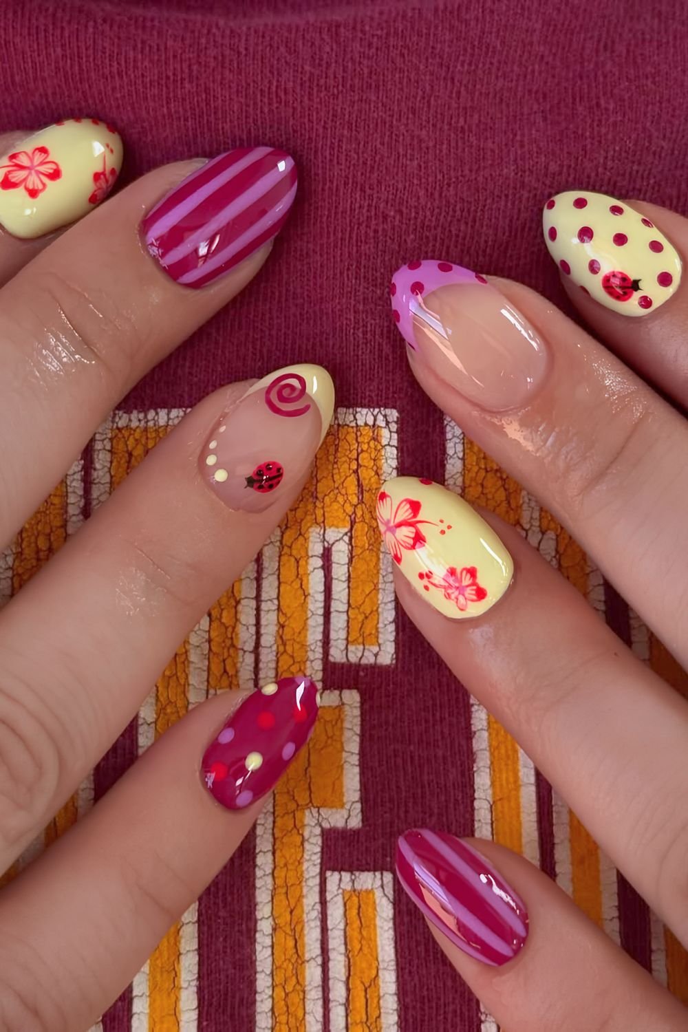 Mix and match ladybug and hibiscus nails