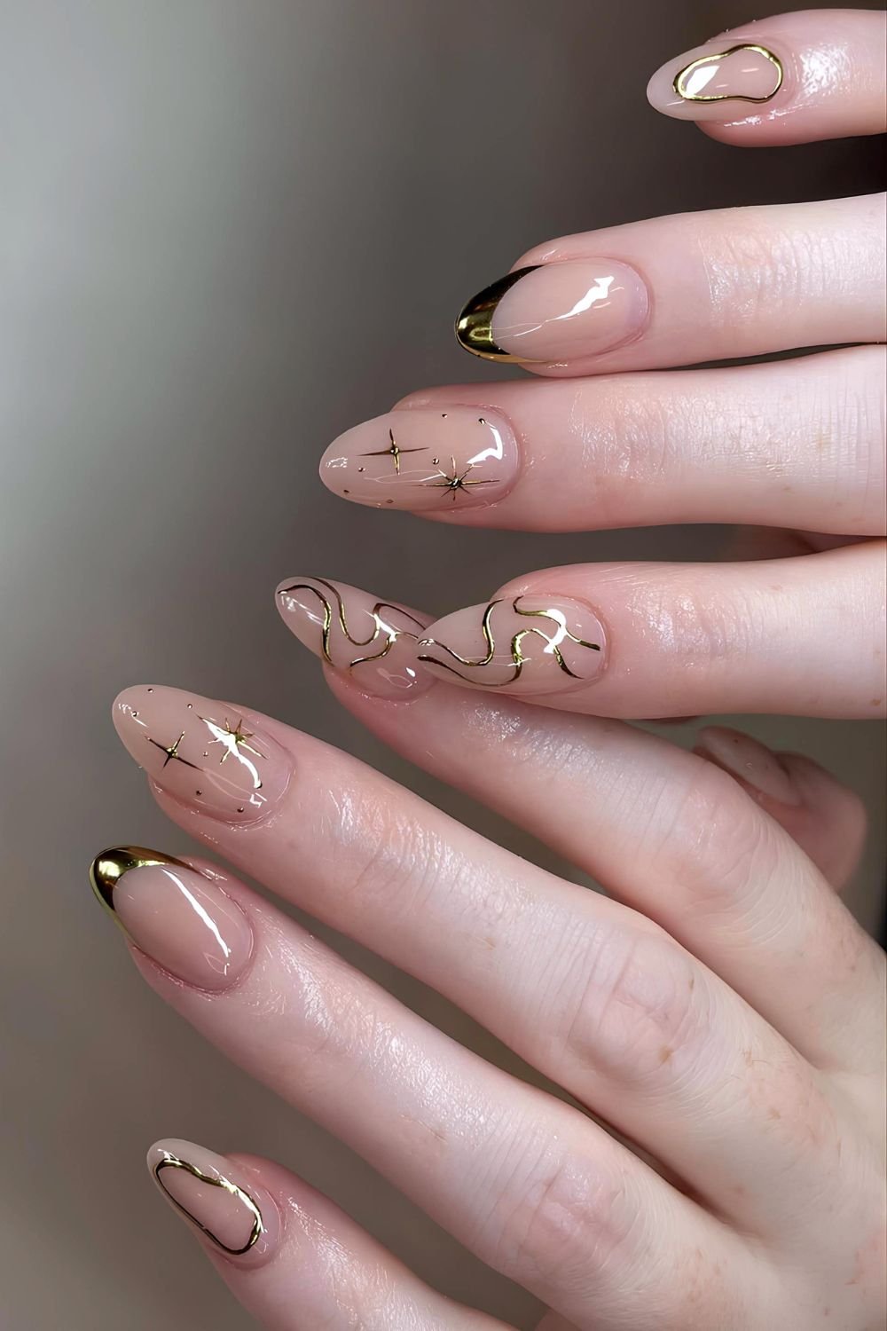 Neutral nails with isolated golden chrom accents