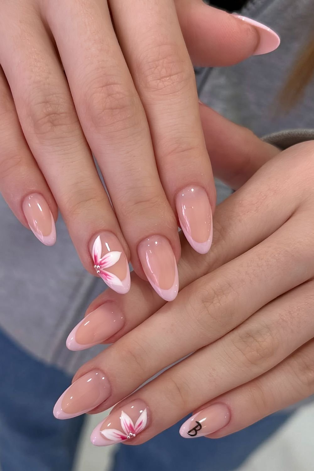 Pink French tips with floral accents