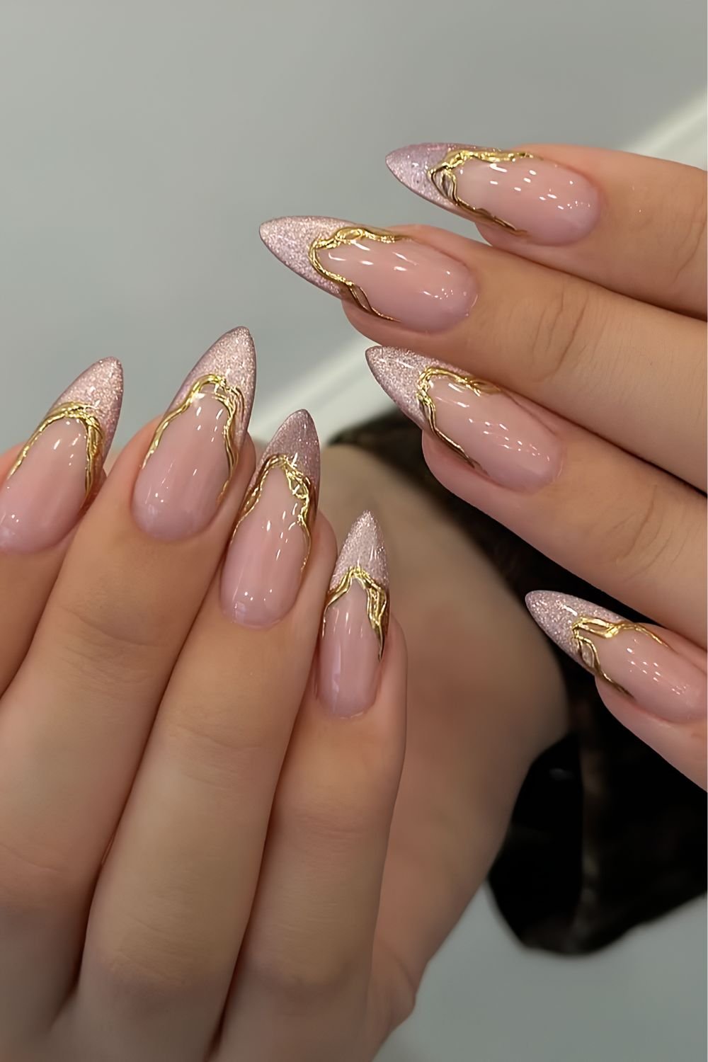 Pink cat eye French tips with molten golden chrome outline