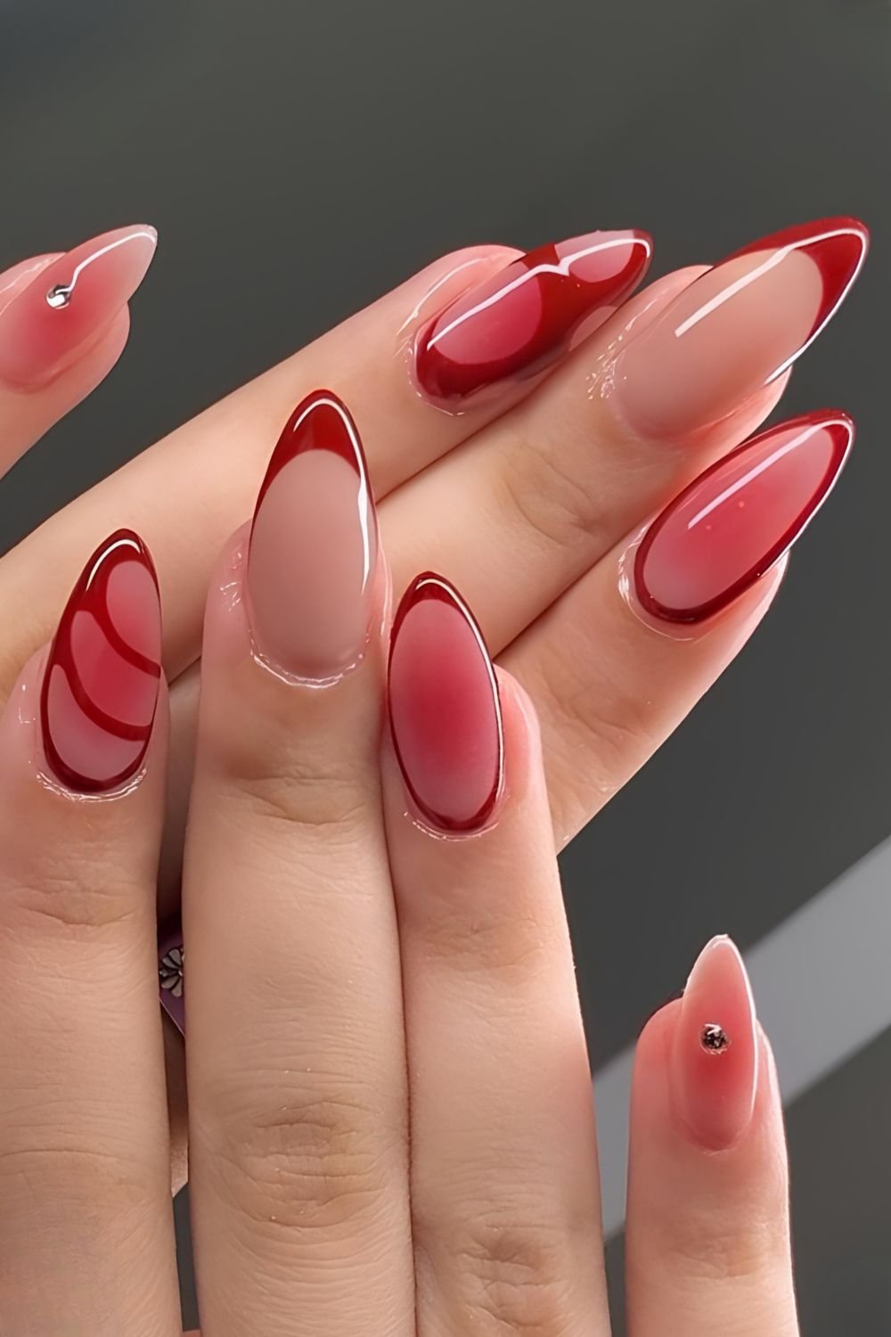 Red aura nails with French tip accents