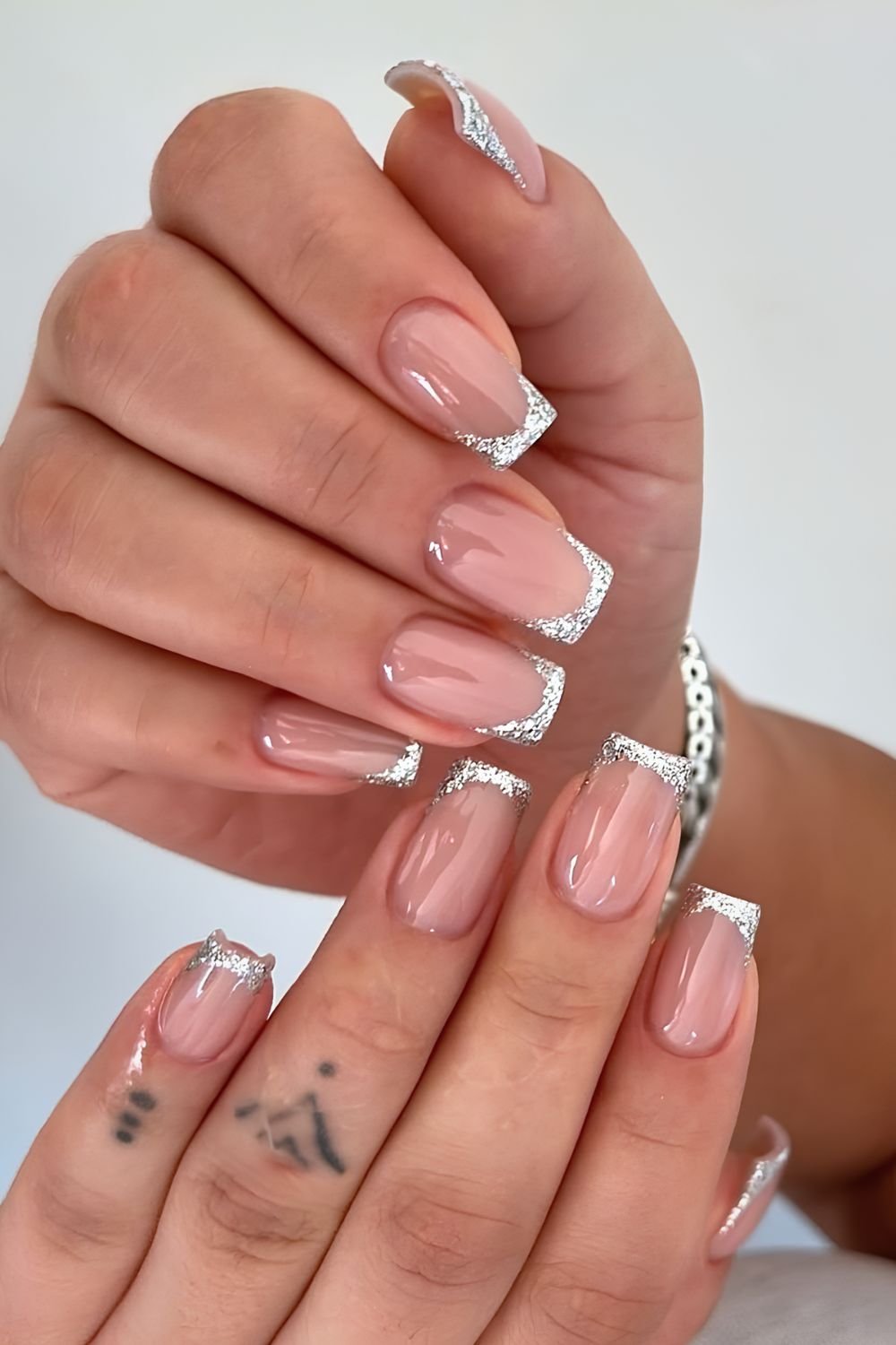 Silver glitter French tip nails