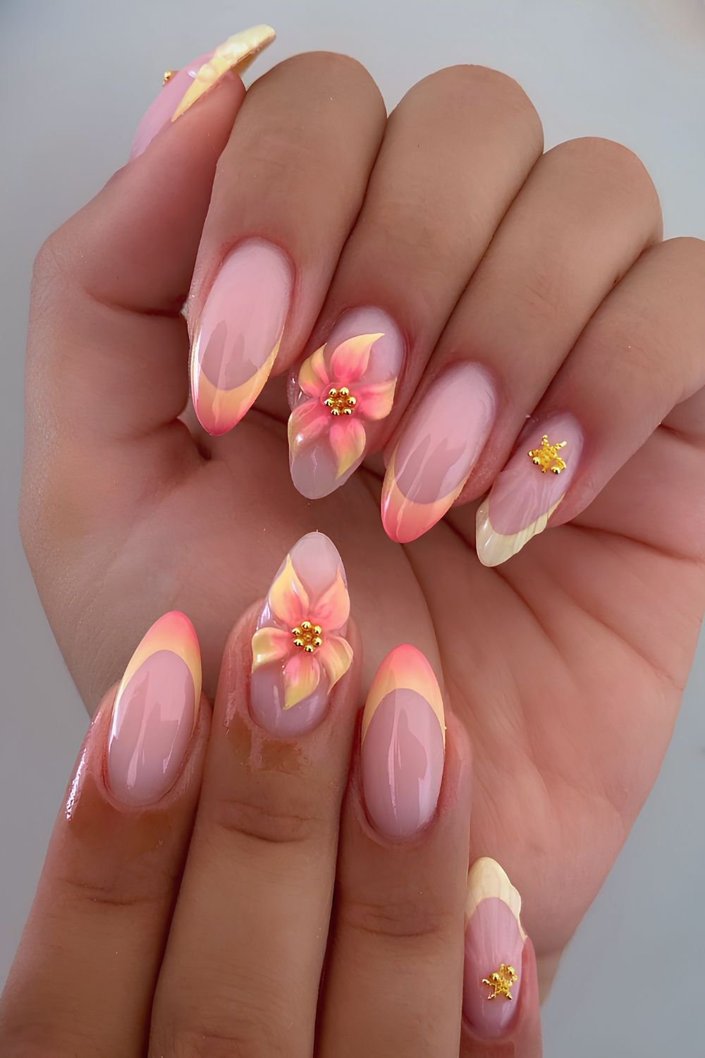 Sunset ombre nails with sculpted flower art