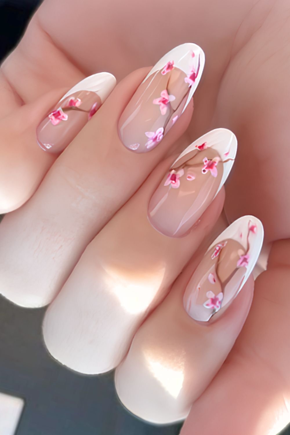 White French tips with cherry blossom branch design