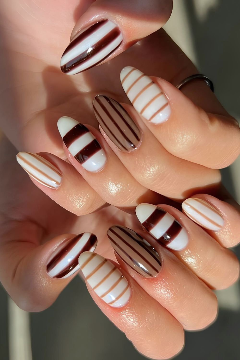 White and different brown shades striped nails