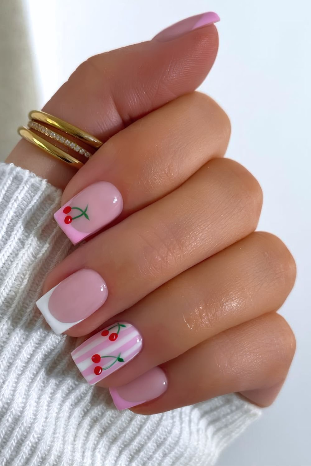 White and pink French tips with stripes and cherry accents