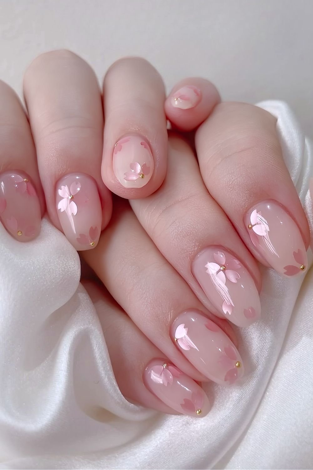 White gel nails with cherry blossom inbuilt floral art