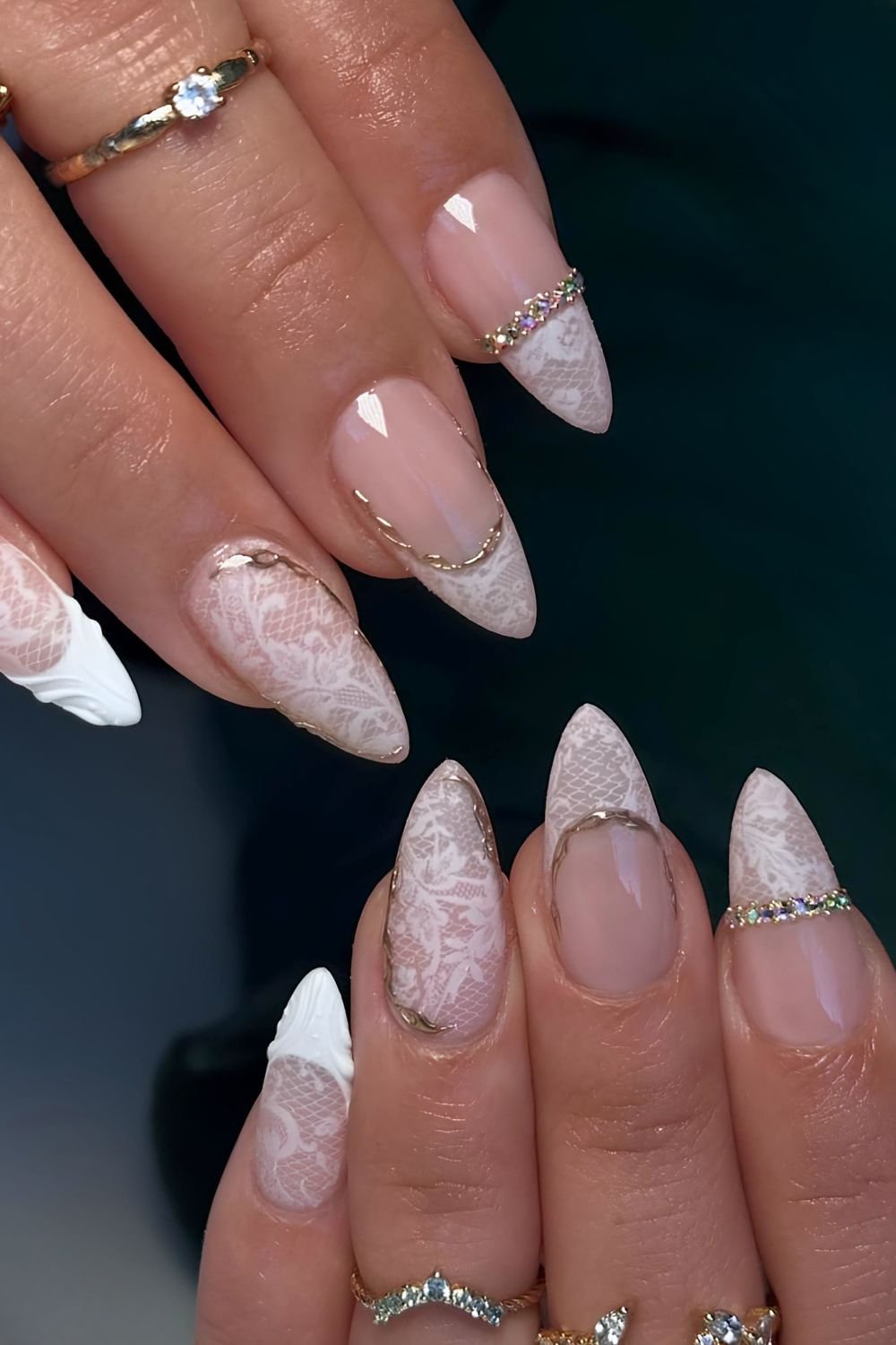 White lace nails with gold chrome details and nail rings