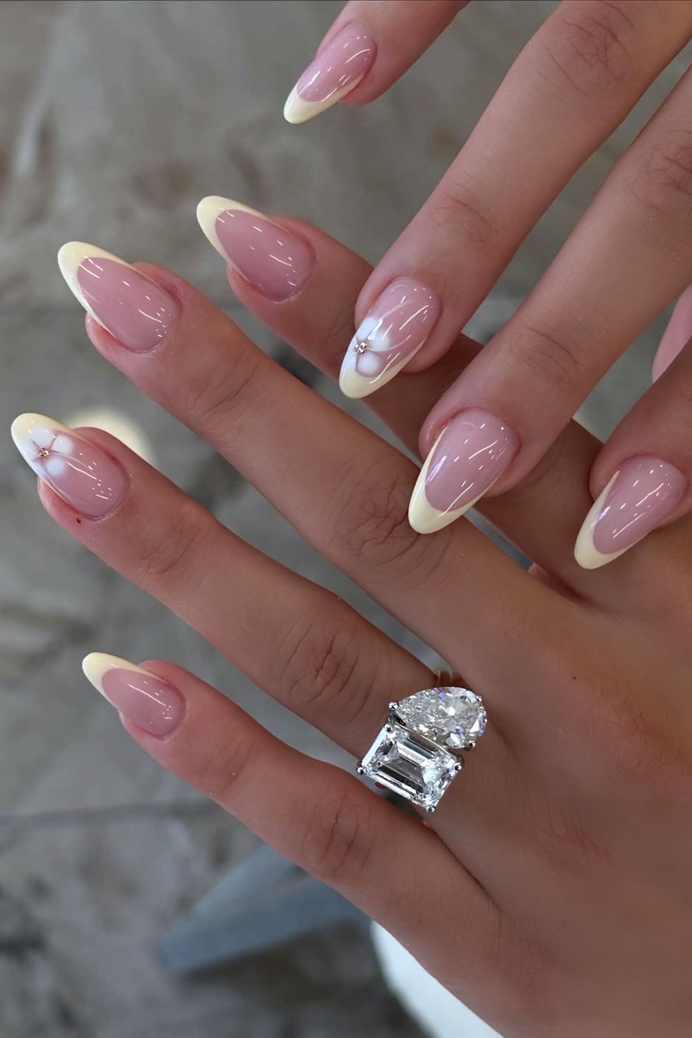 Yellow French nails with white blooming gel floral accents