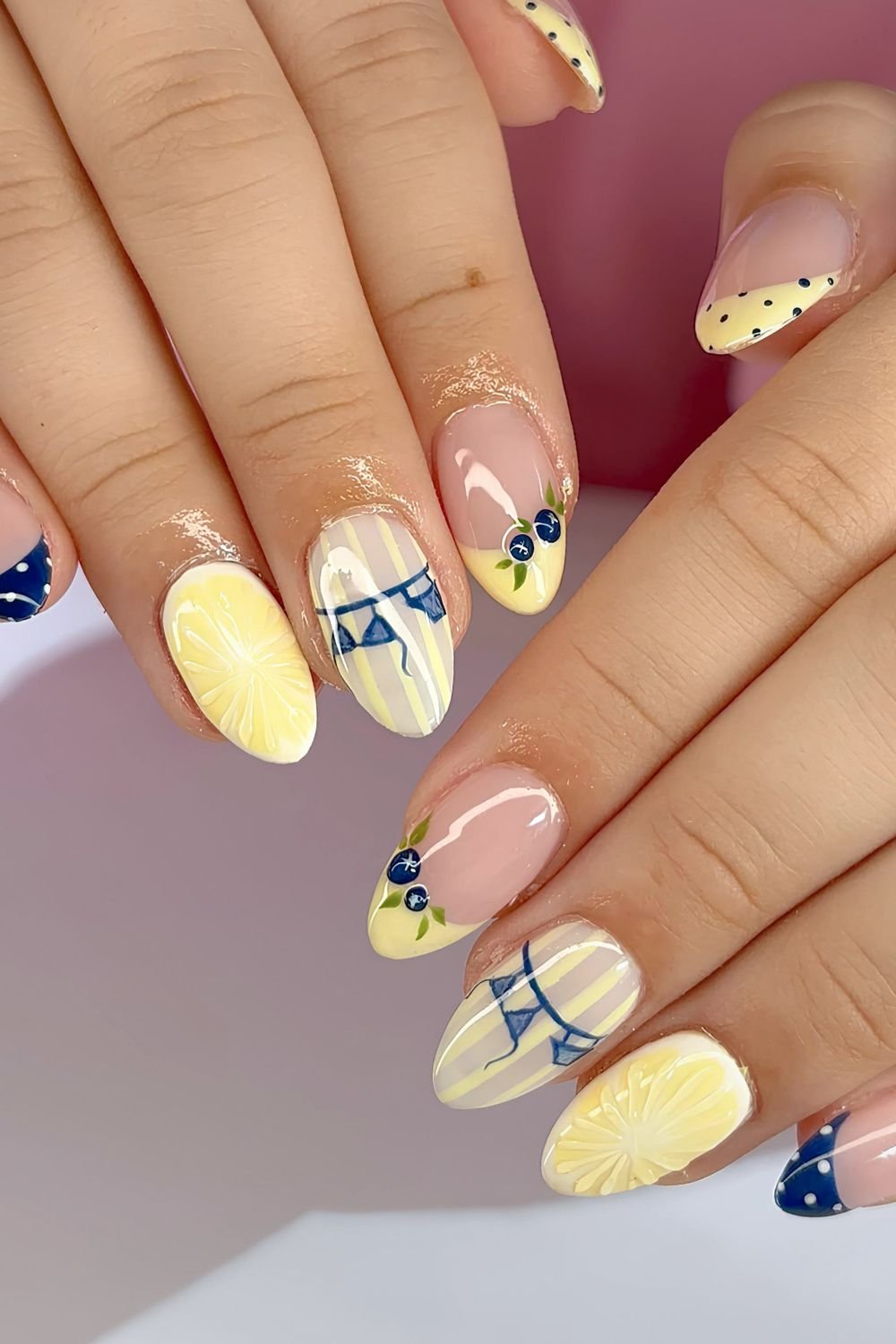 Yellow lemon and blueberry nails with tiny bikini nail art