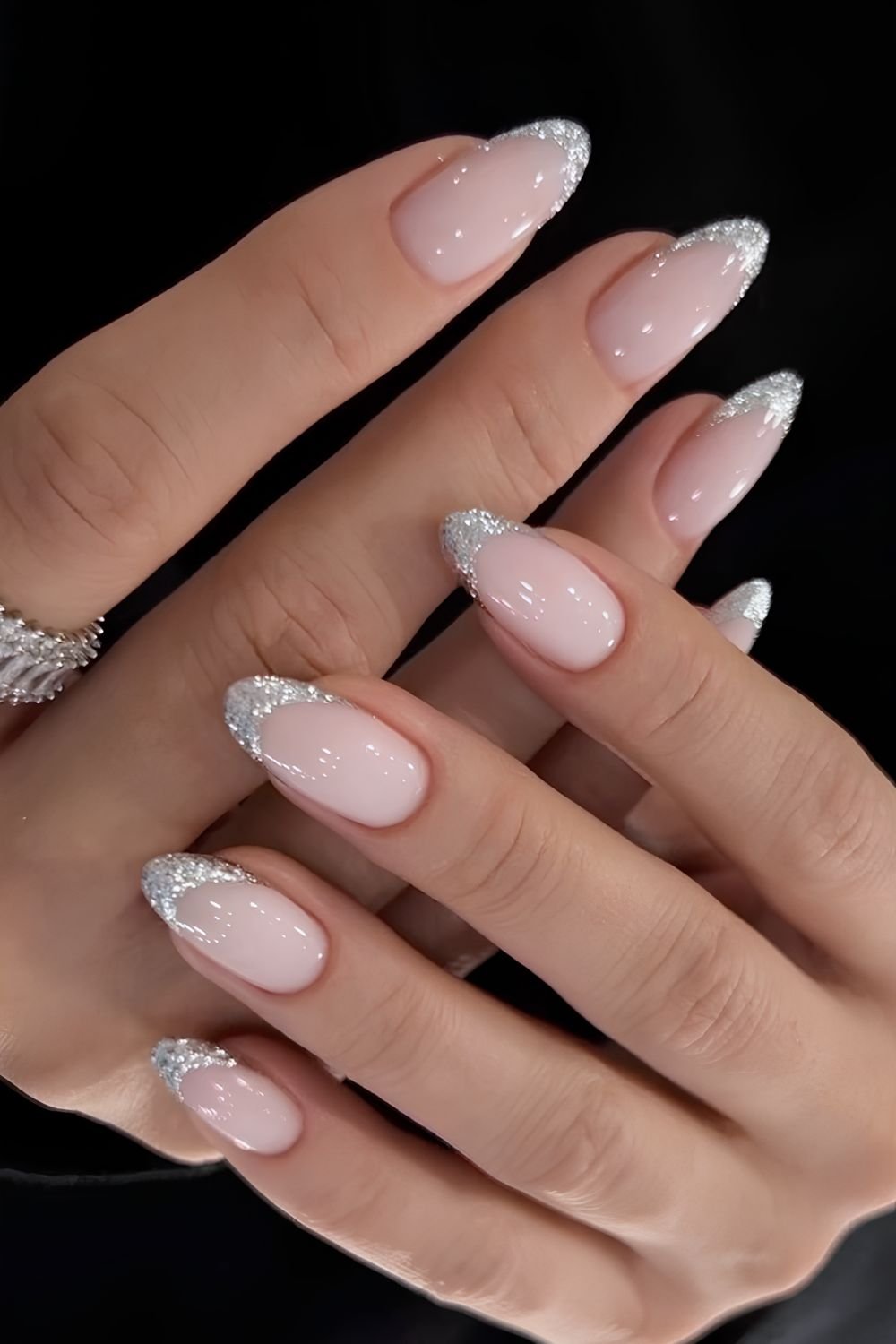 Almond-shaped silver glitter French manicure