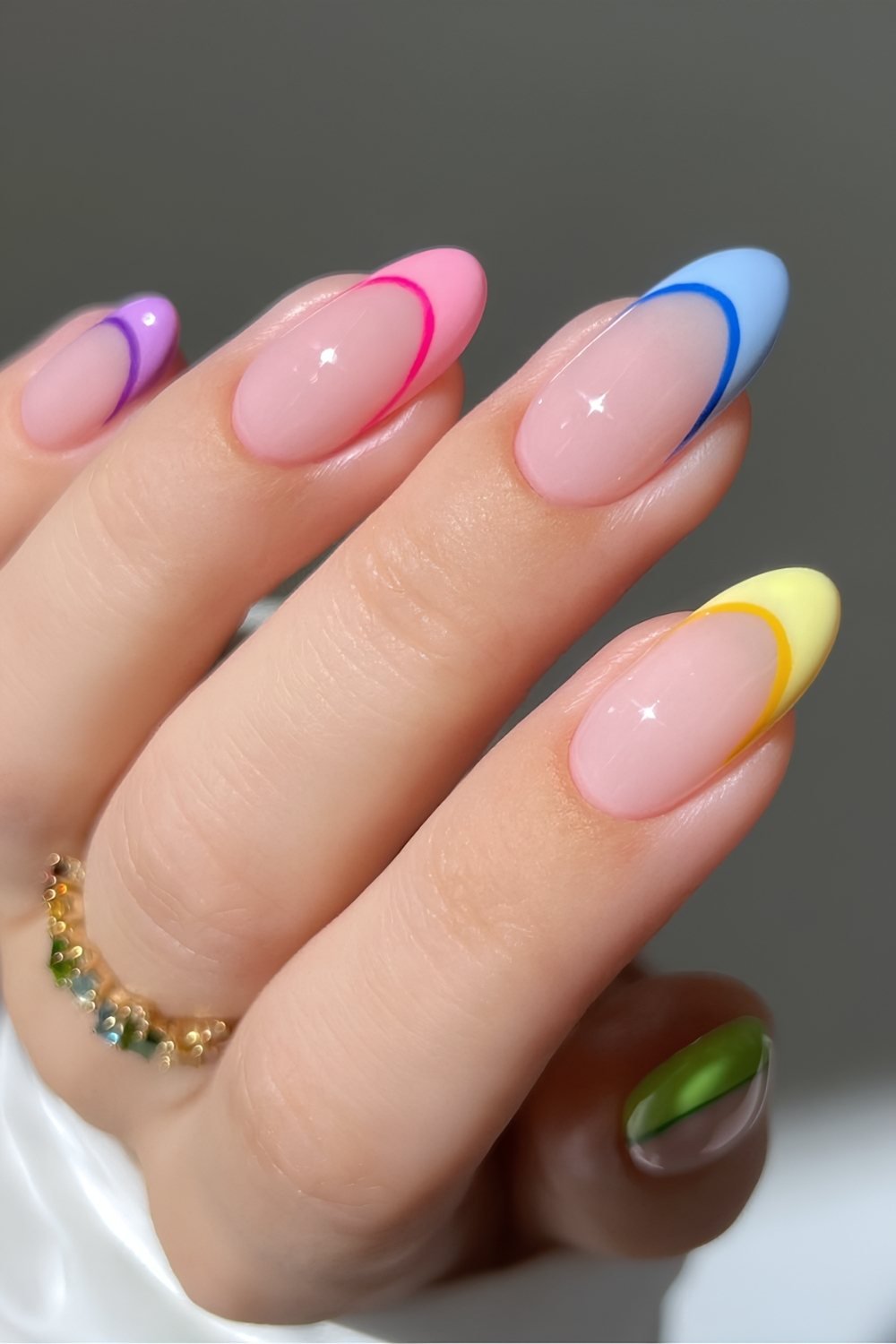 Colorful skittle French nails with matching color outlines