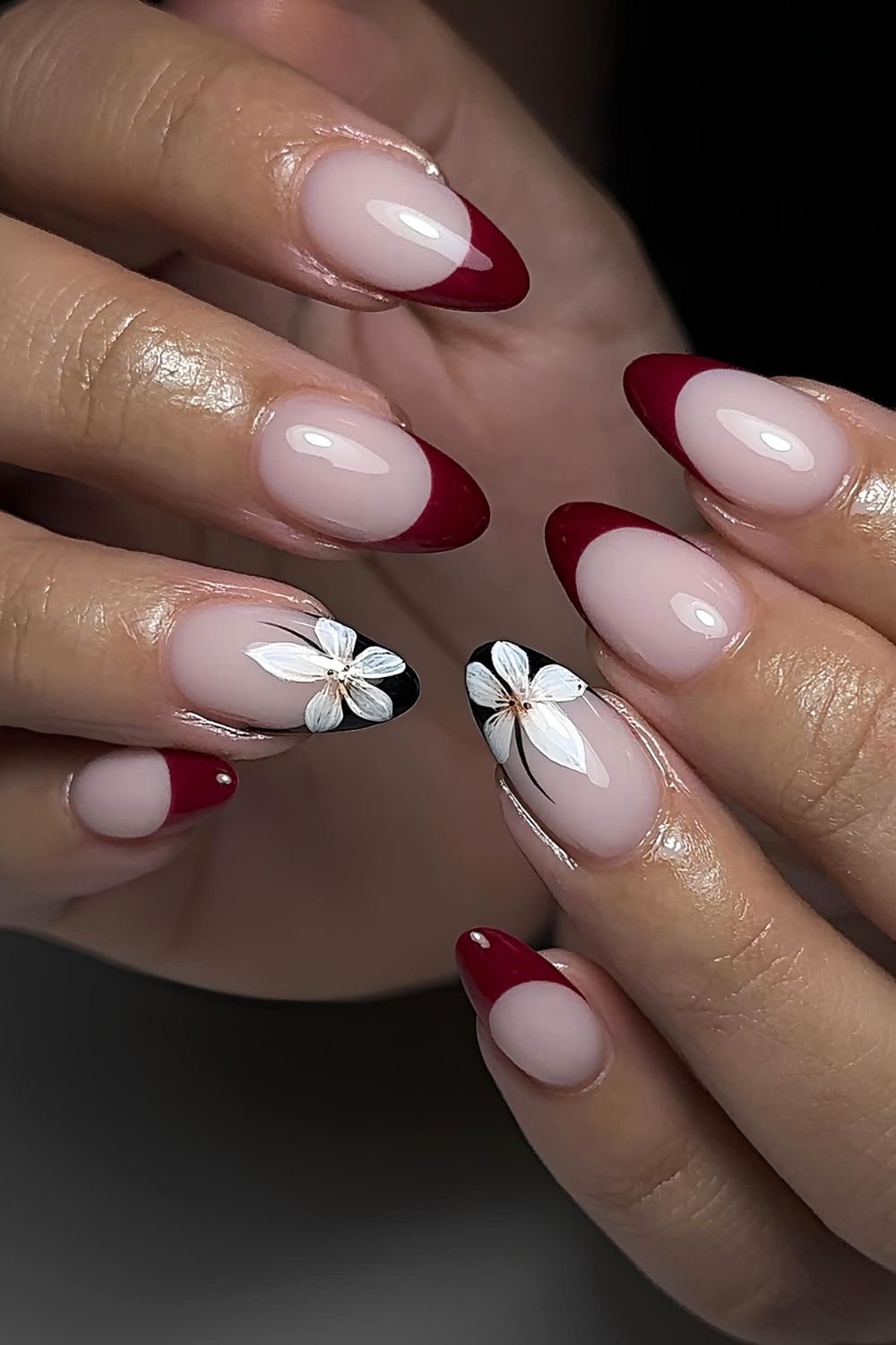 Dark red French nails with black tip with white flower accents