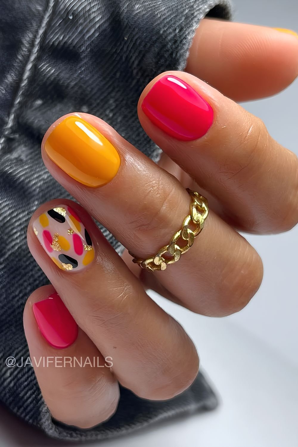Fuchsia pink and orange nails with colorful accent nails