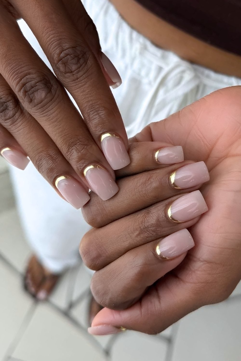 Golden chrome reversed French nails