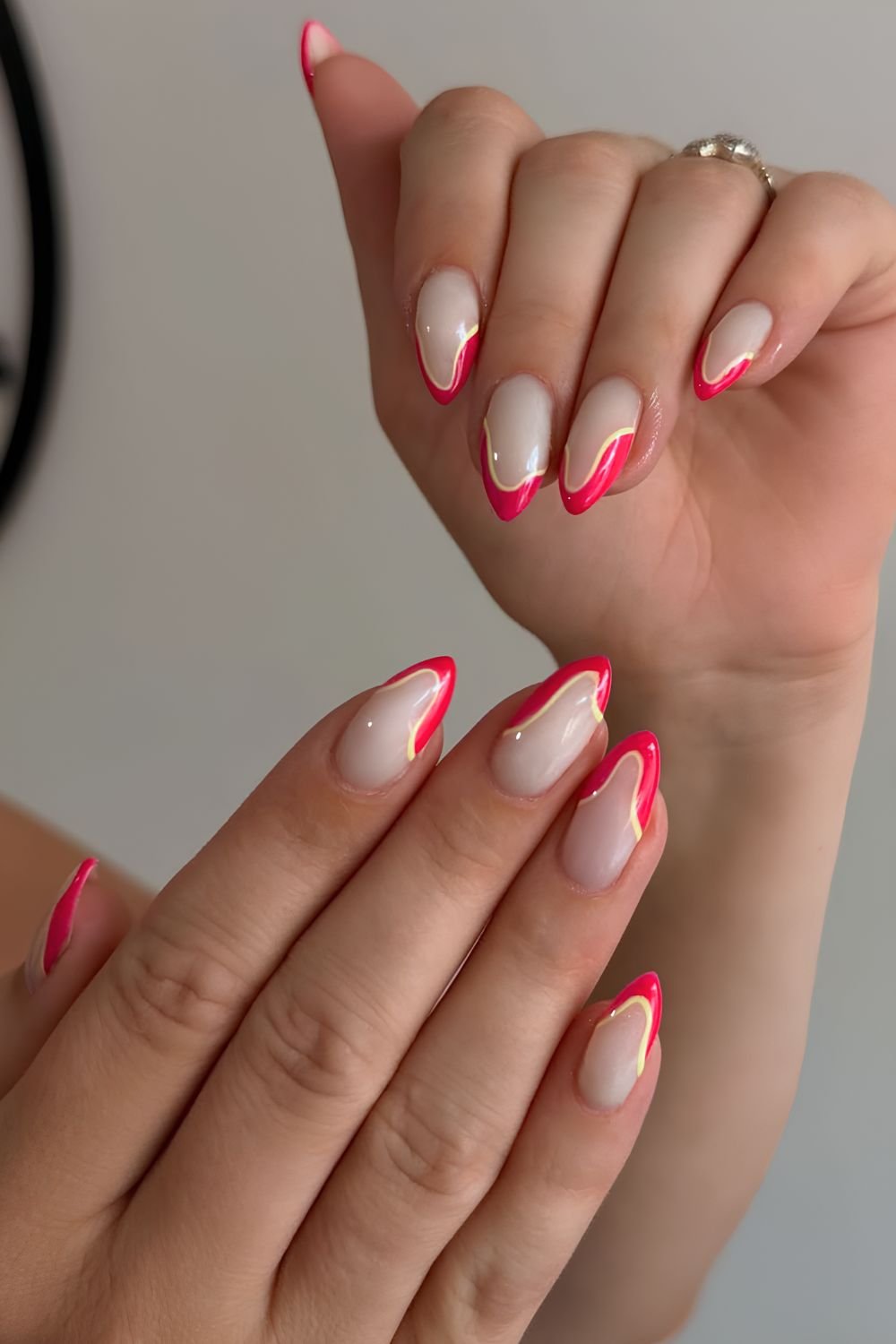 Hot pink abstract French nails with yellow outline
