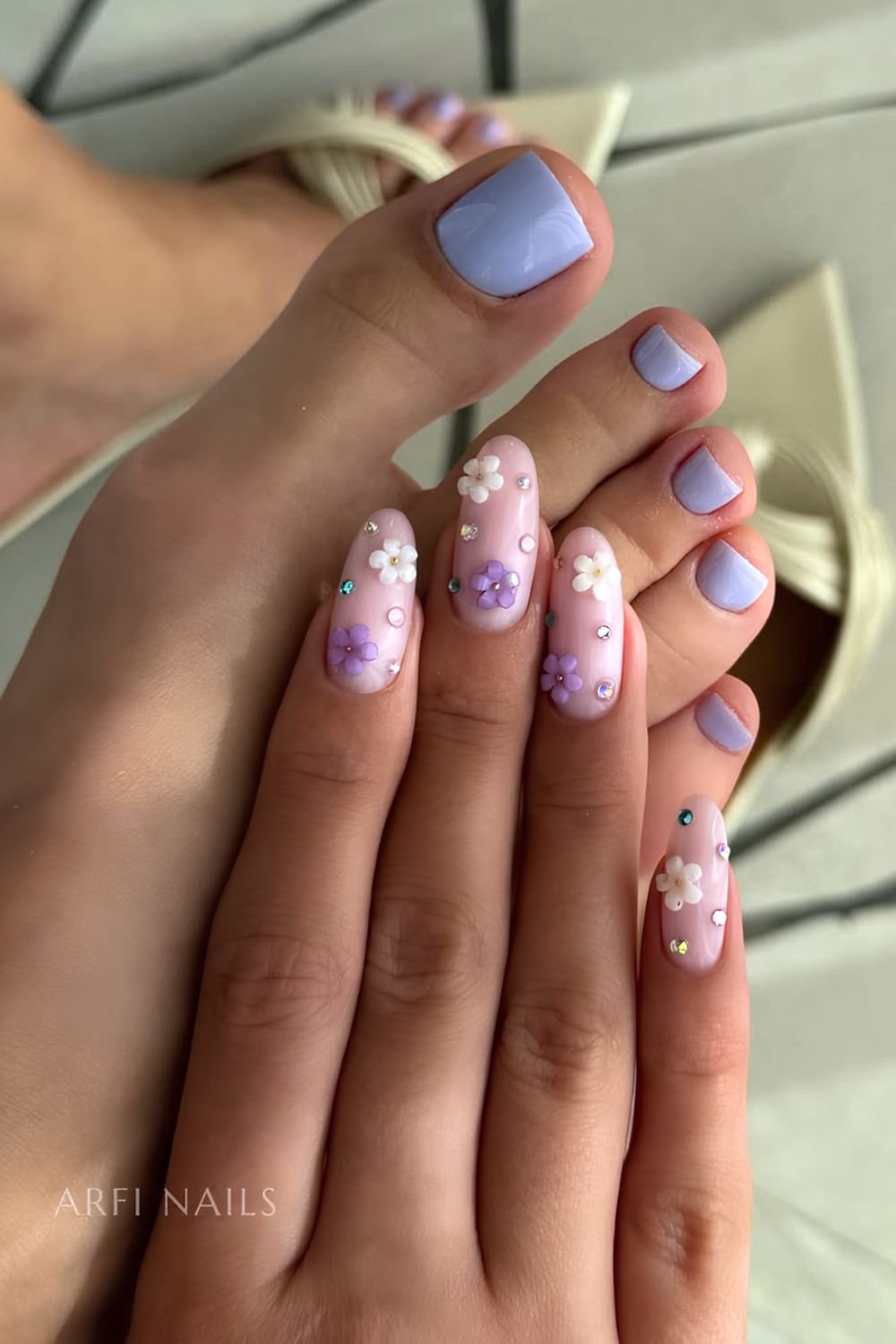 Lavender pedicure and 3D floral manicure in white and purple with gems