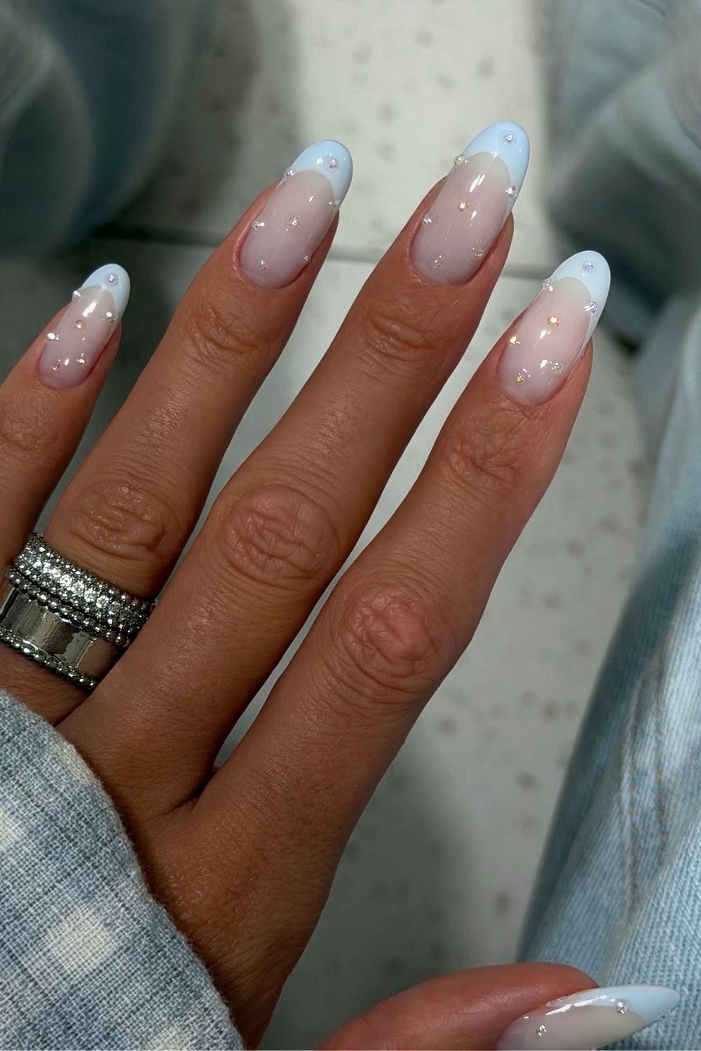 Light blue French manicure with pearl accents