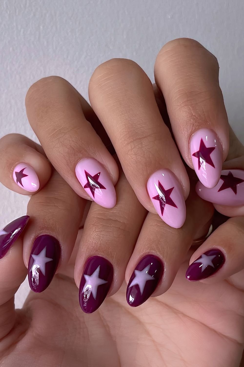 Light pink and purple plum star nails