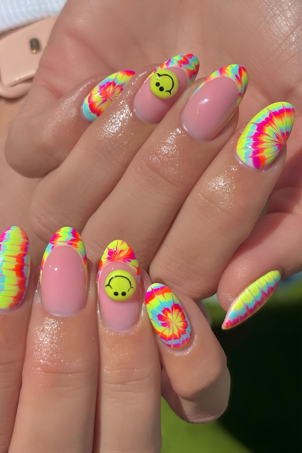 Neon tie-dye nails with 3D smiley accents