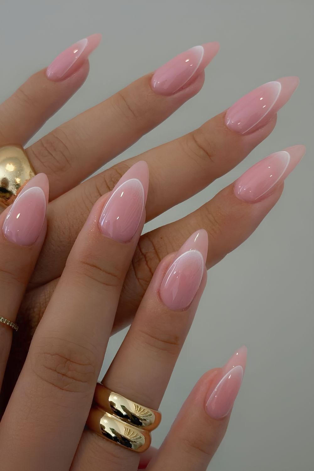 Neutral pink nails with white French tip outline