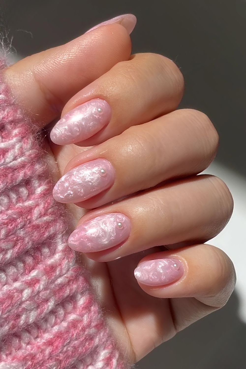 Pearly pink nails with cuff centered pearls