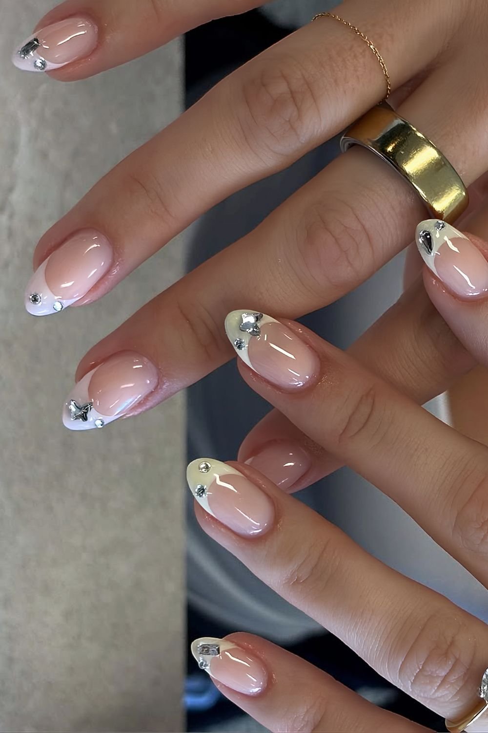 Pink and yellow mismatched hands French mani with crystals on tips