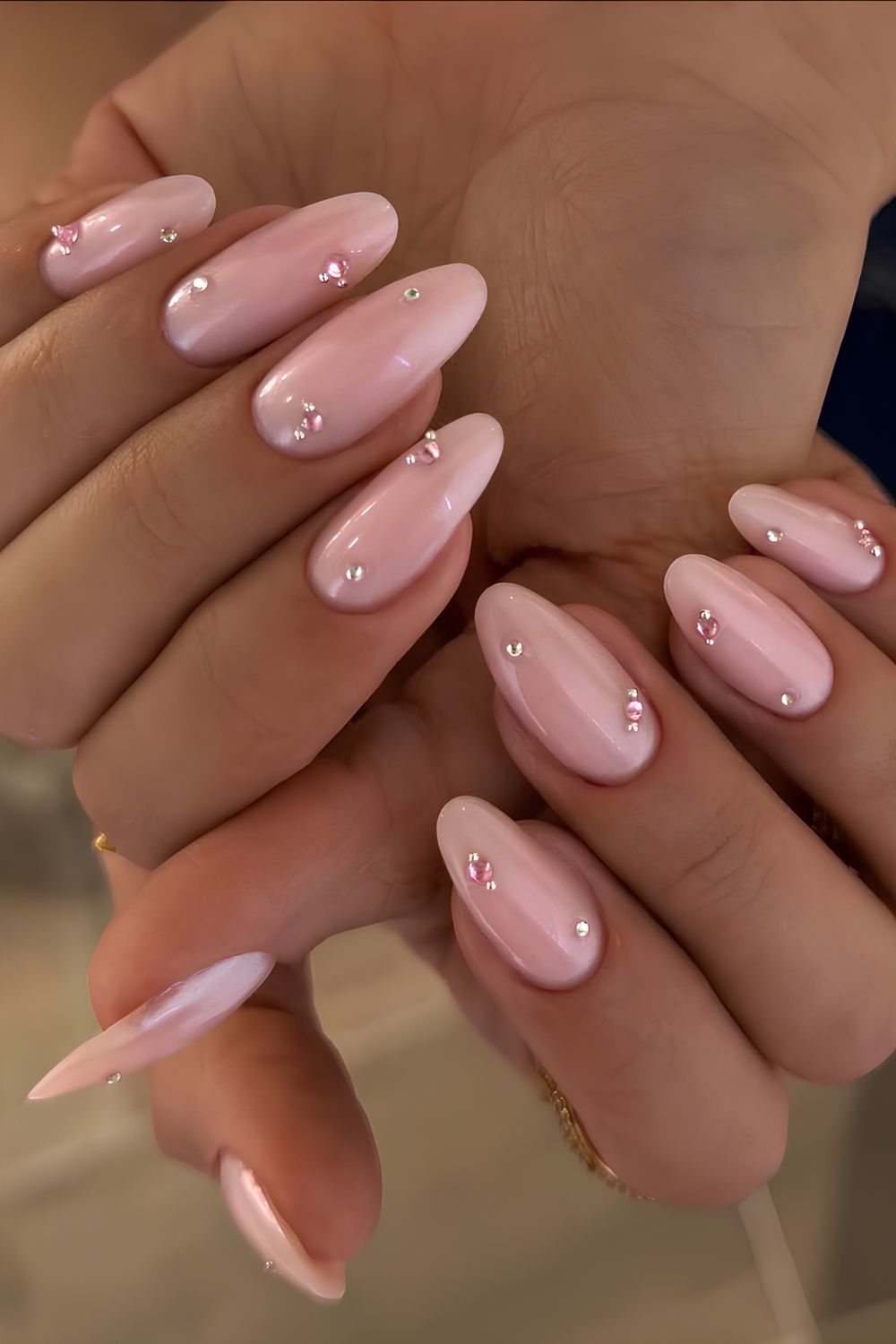 Powder pink nails with pink and silver gems