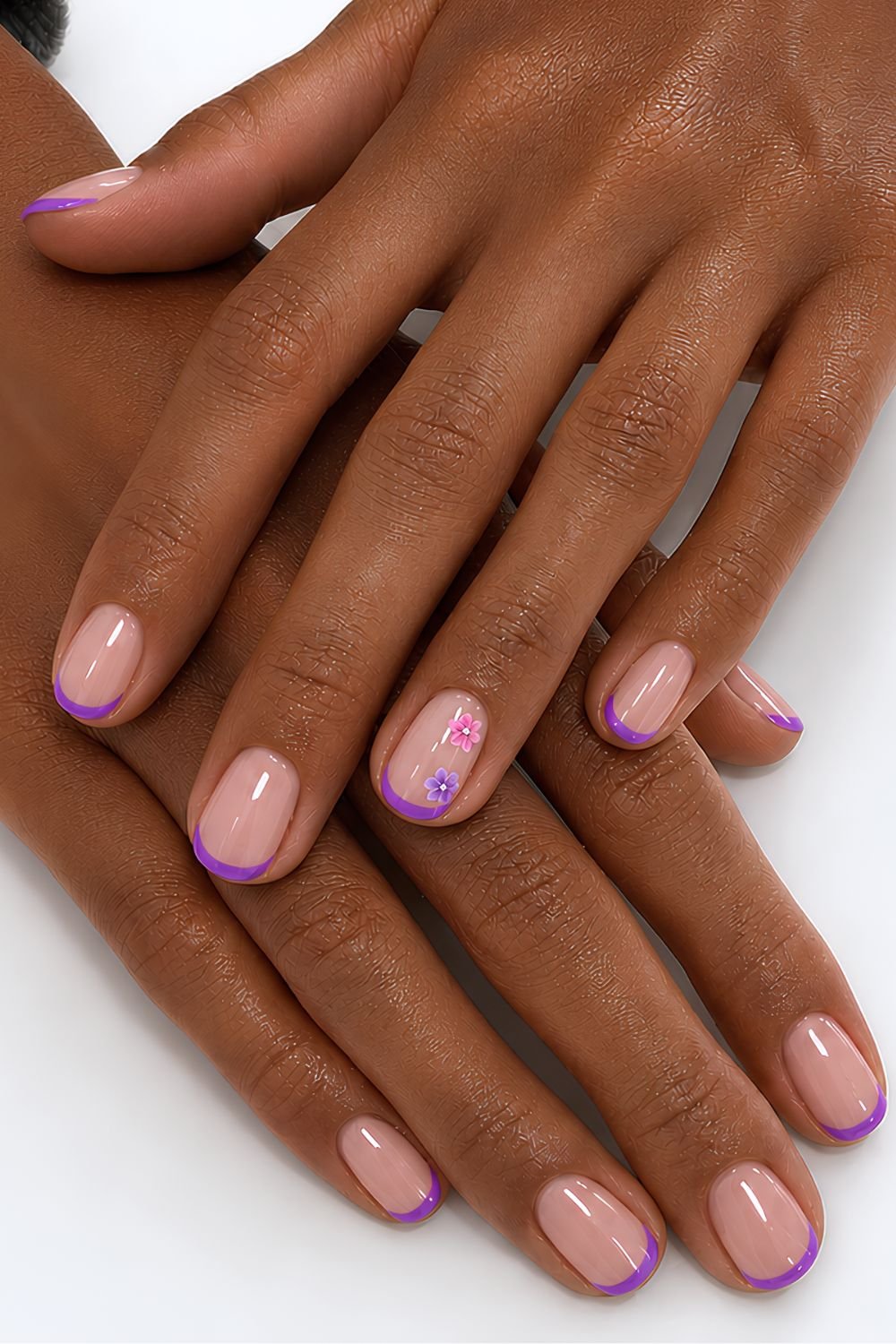 Purple Micro French tip nails with subtle purple and pink floral design