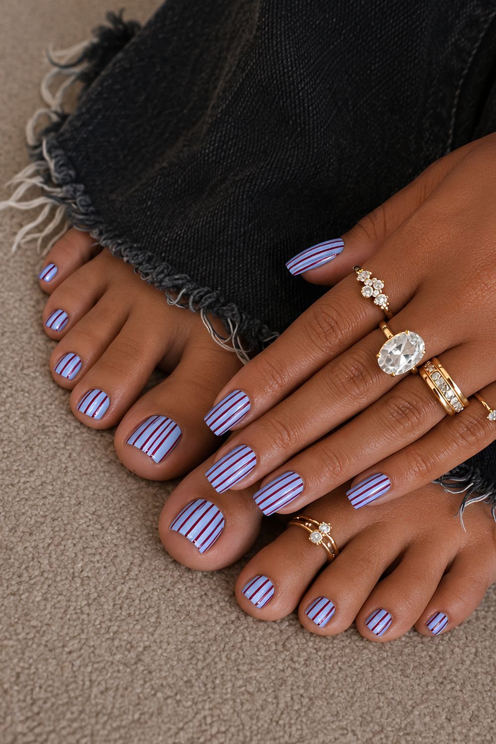 Striped light blue and burgundy manicure and pedicure